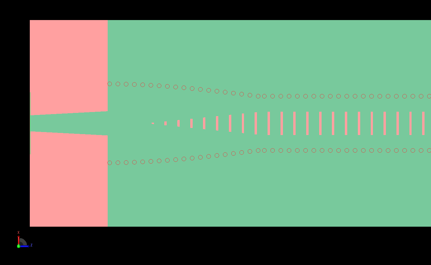 Figura 2: Una vista detallada de un extremo de la antena muestra las ranuras cónicas y la vía curva situada bajo la línea microstrip.